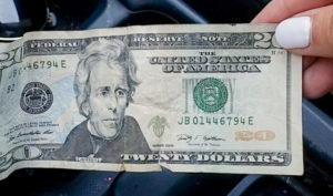 how to quit buying things to save money - twenty dollar bill